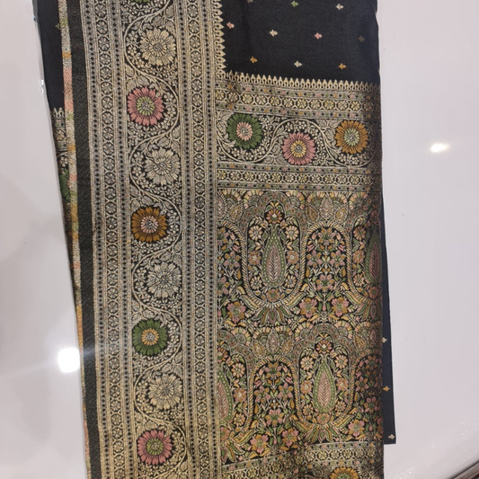 Black Benarasi saree with intricate gold zari detailing with tassels