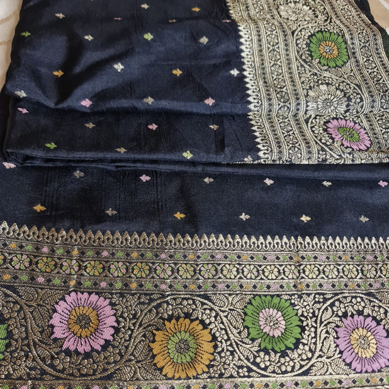 Black Benarasi saree with intricate gold zari detailing with tassels