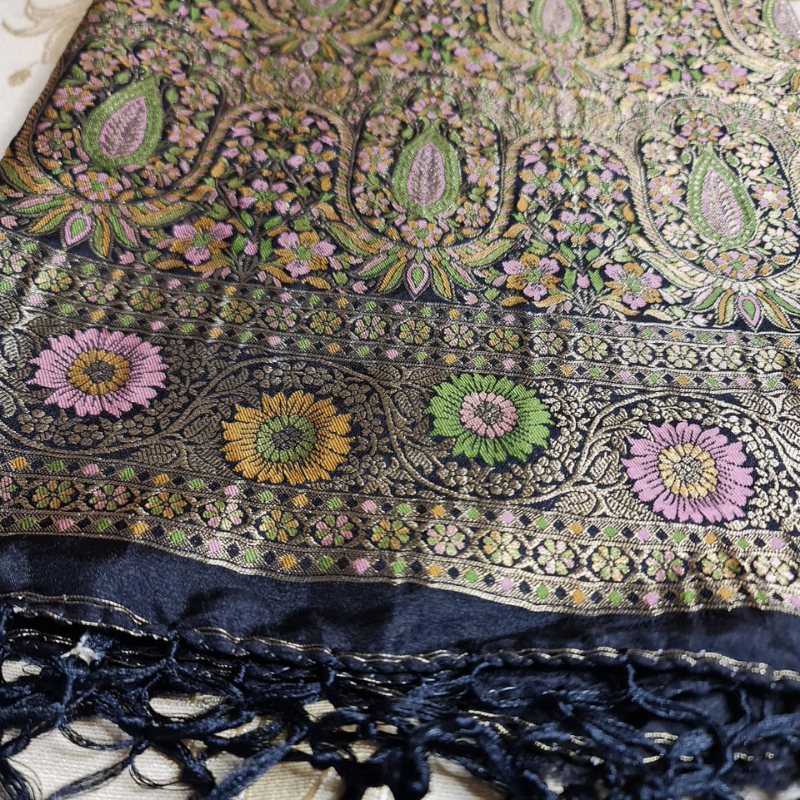 Black Benarasi saree with intricate gold zari detailing with tassels