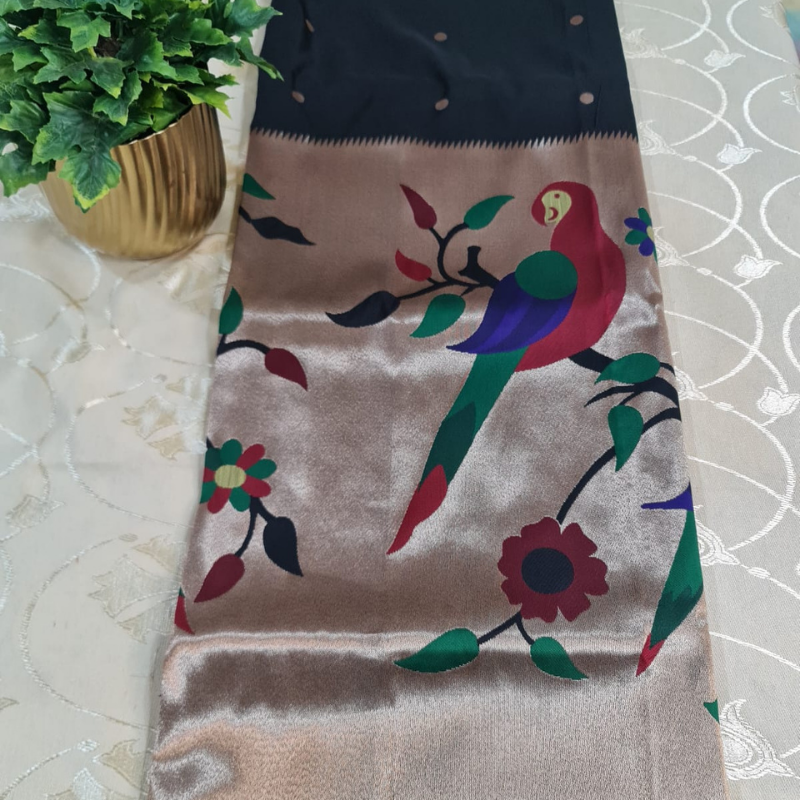 Black Paithani saree with traditional peacock & lotus motifs in gold zari border with tassels