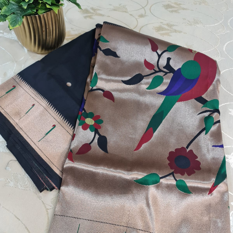 Black Paithani saree with traditional peacock & lotus motifs in gold zari border with tassels