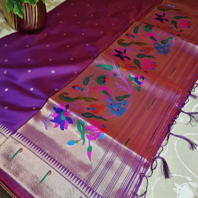 Dual Tone Magenta Paithani saree with traditional peacock & lotus motifs in gold zari border with tassels