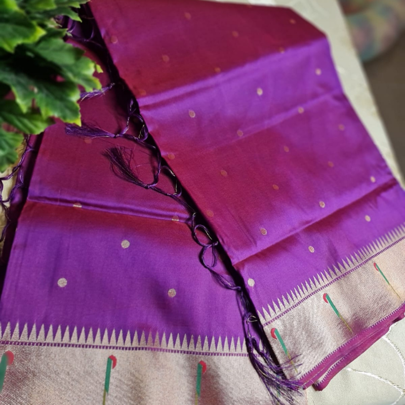 Dual Tone Magenta Paithani saree with traditional peacock & lotus motifs in gold zari border with tassels