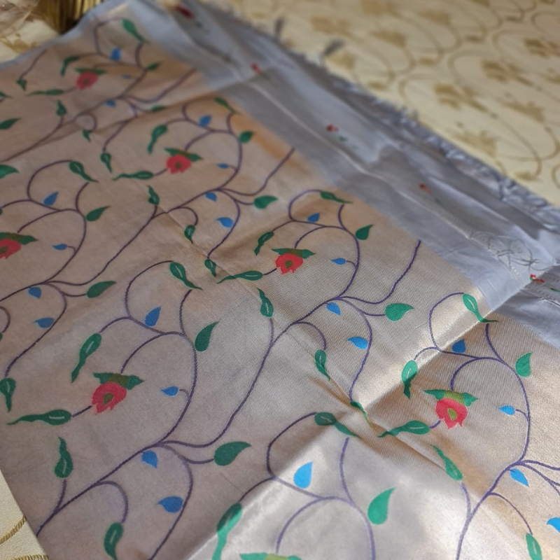Grey Paithani saree with traditional peacock & lotus motifs in gold zari border with tassels