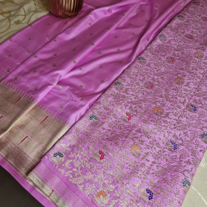 Handwoven Light Pink color Paithani saree with traditional colorful peacock and lotus motifs in gold zari border with tassels