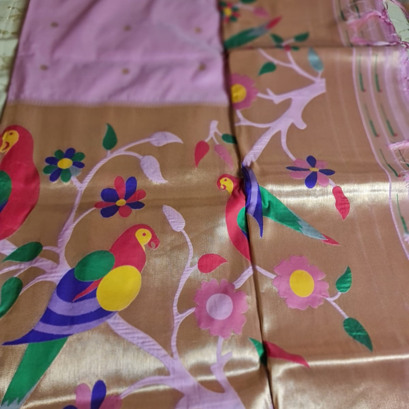 Light Pink Paithani saree with traditional peacock & lotus motifs in gold zari border with tassels