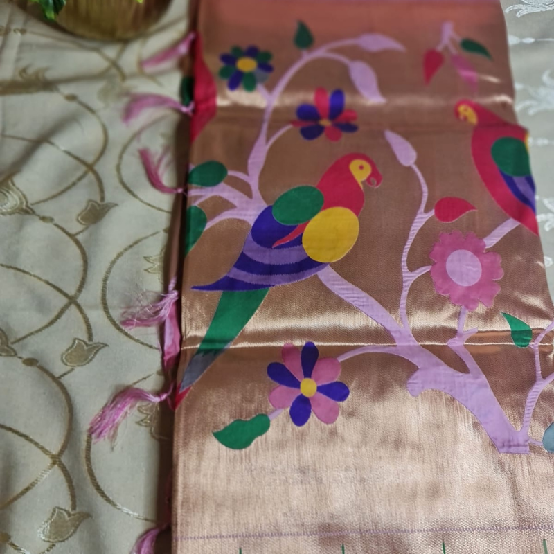 Light Pink Paithani saree with traditional peacock & lotus motifs in gold zari border with tassels