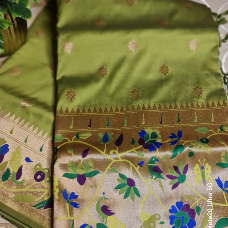 Lime Green color Paithani saree with traditional peacock & lotus motifs in gold zari border with tassels
