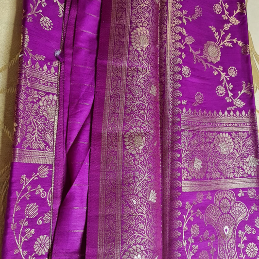Magenta Benarasi saree with intricate gold zari detailing with tassels