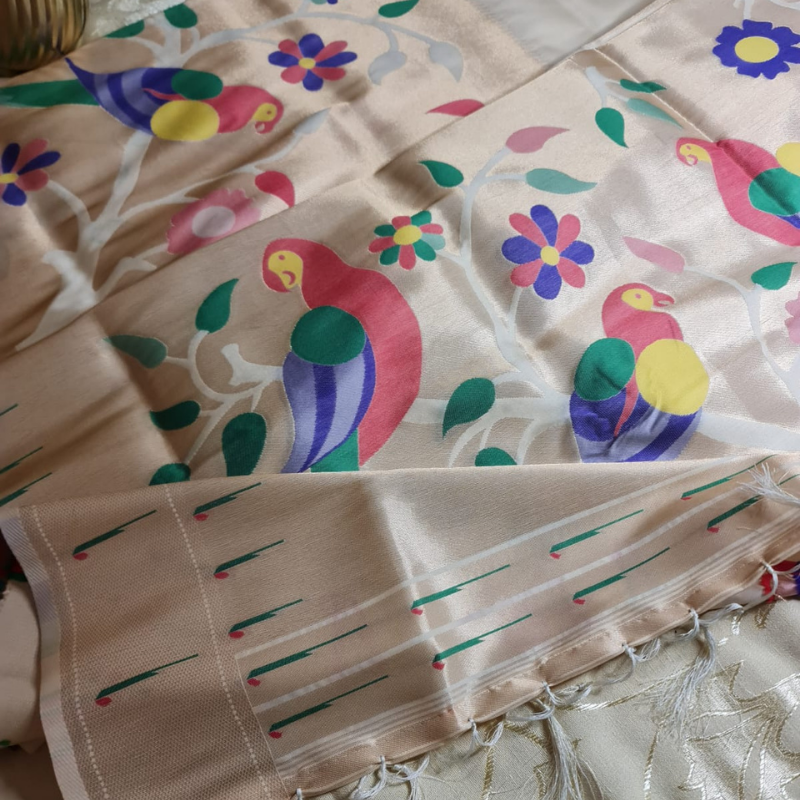 Off White Paithani saree with traditional peacock & lotus motifs in gold zari border with tassels
