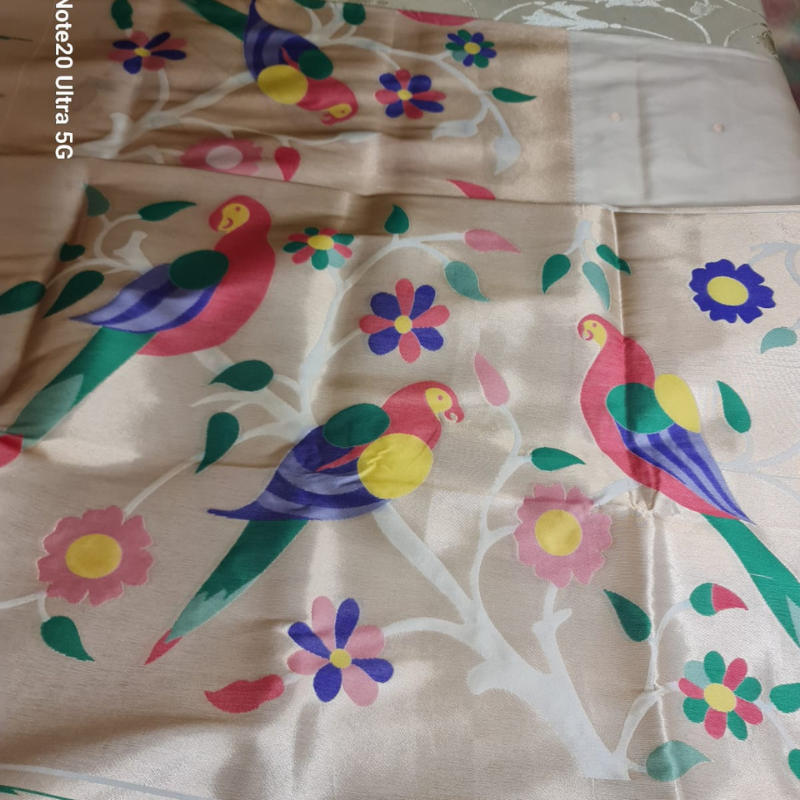 Off White Paithani saree with traditional peacock & lotus motifs in gold zari border with tassels