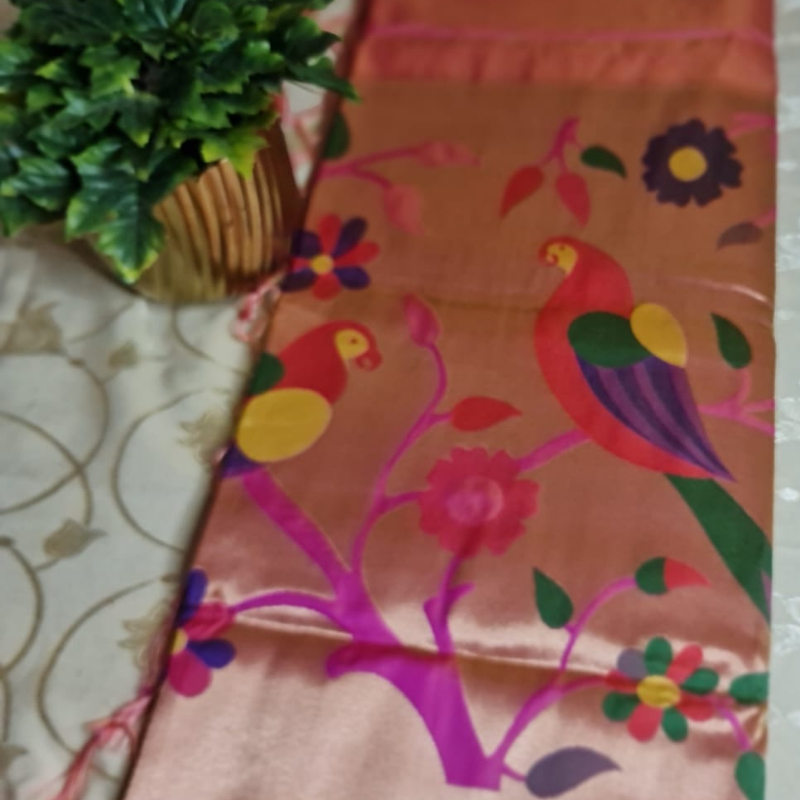 Peach Paithani saree with traditional peacock & lotus motifs in gold zari border with tassels