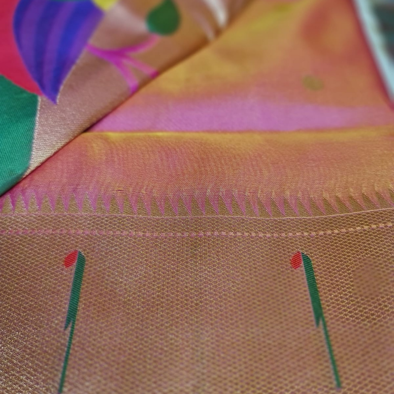 Peach Paithani saree with traditional peacock & lotus motifs in gold zari border with tassels