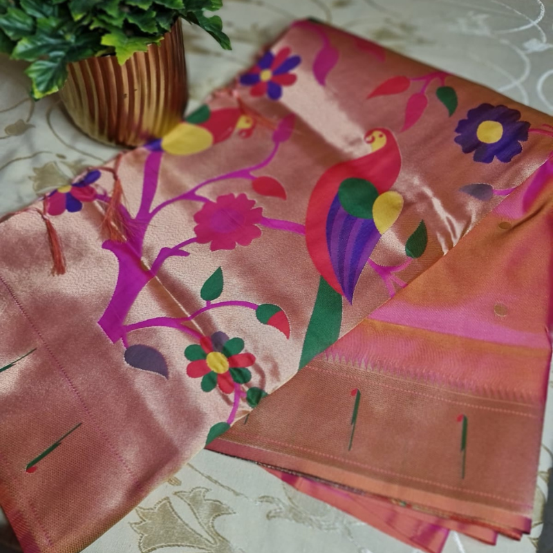 Peach Paithani saree with traditional peacock & lotus motifs in gold zari border with tassels