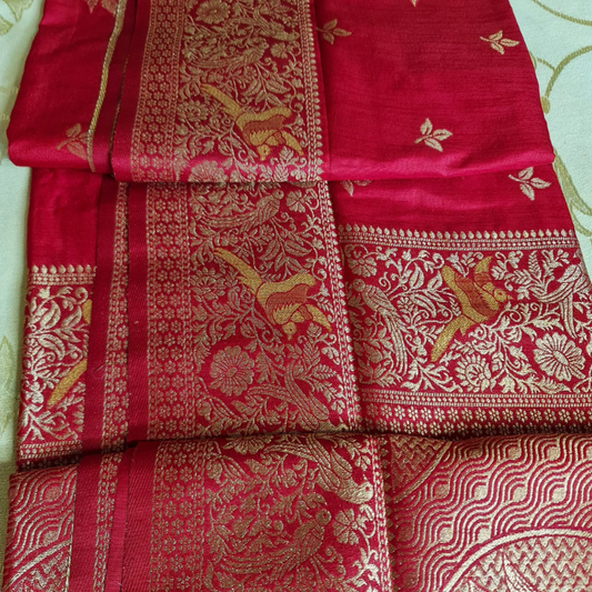 Red Benarasi saree with intricate gold zari detailing with tassels