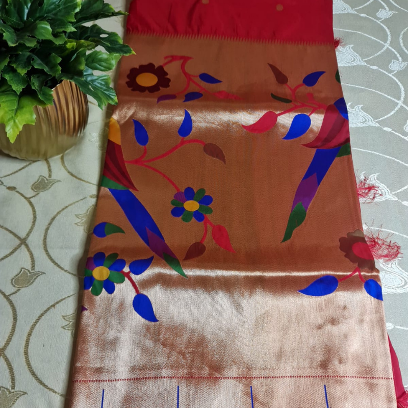 Red Paithani saree with traditional peacock & lotus motifs in gold zari border with tassels