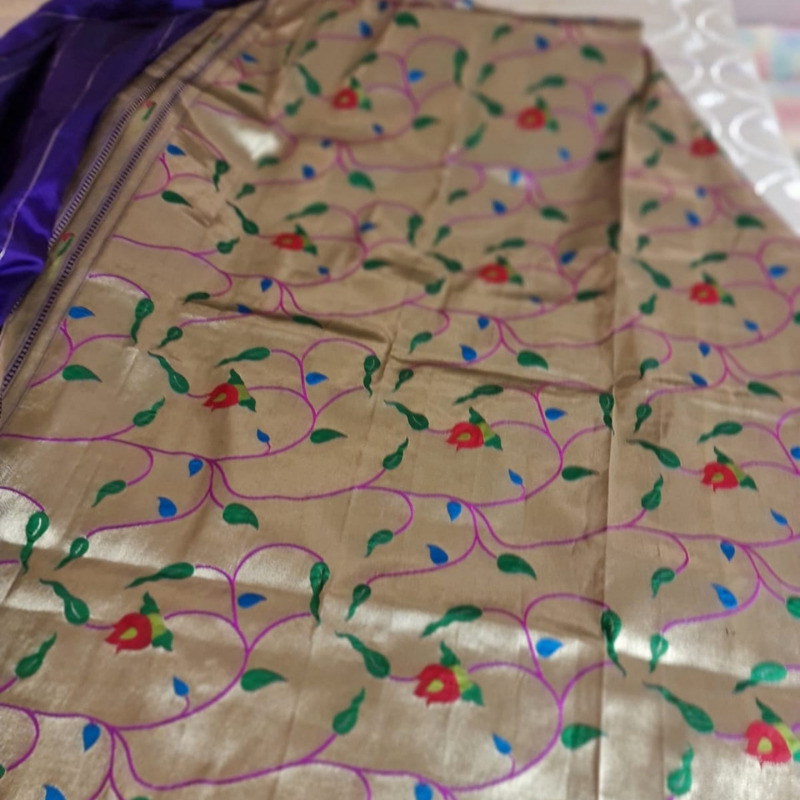 Royal Blue Paithani saree with traditional peacock & lotus motifs in gold zari border with tassels