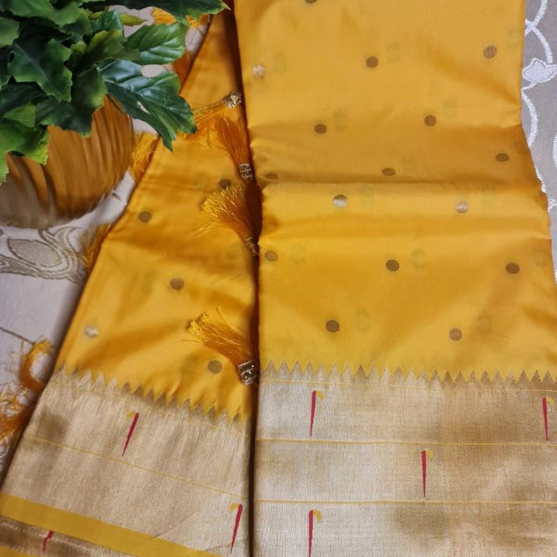 Handwoven Yellow color Paithani saree with traditional colorful peacock and lotus motifs in gold zari border with tassels