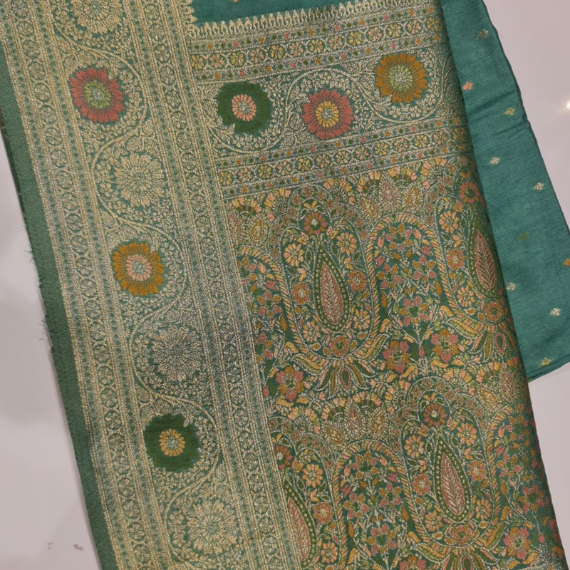 Teal Benarasi saree with intricate gold zari detailing with tassels