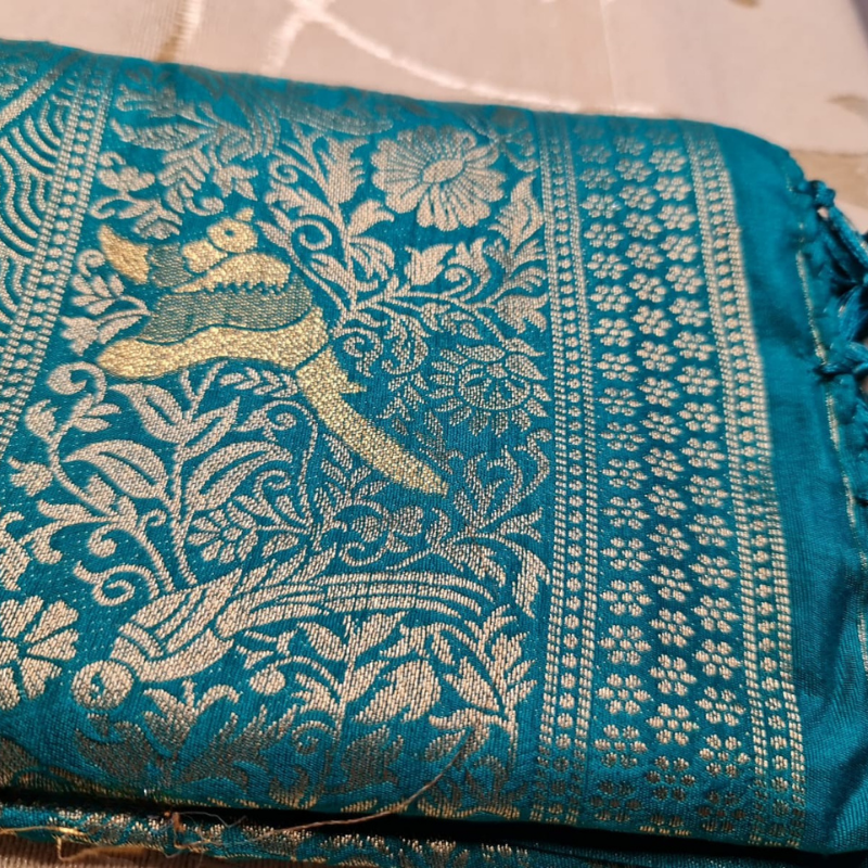 Teal Green Benarasi saree with intricate gold zari detailing with tassels