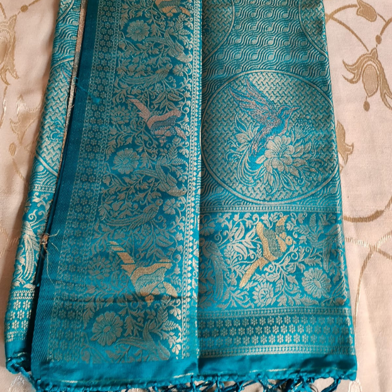 Teal Green Benarasi saree with intricate gold zari detailing with tassels