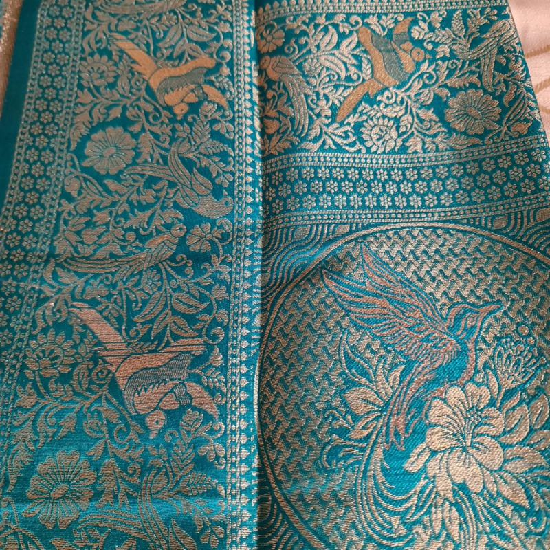 Teal Green Benarasi saree with intricate gold zari detailing with tassels