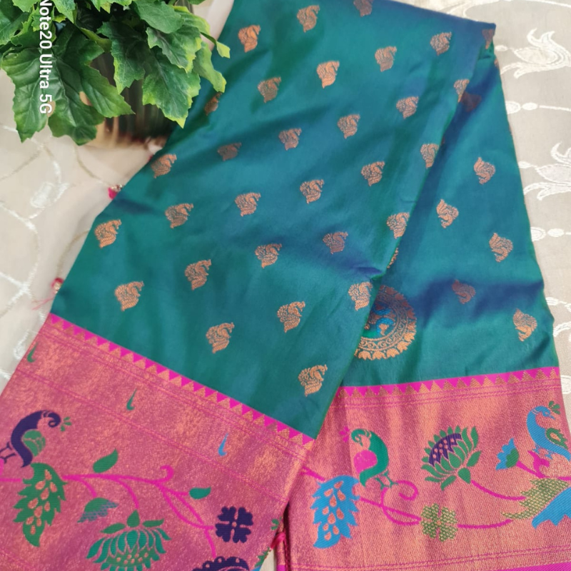 Handwoven Paithani saree with traditional colorful peacock and lotus motifs in gold brocade border