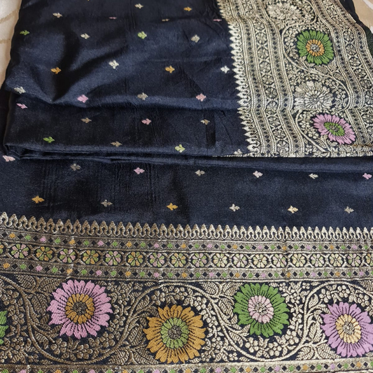 Black Benarasi saree with intricate gold zari detailing with tassels