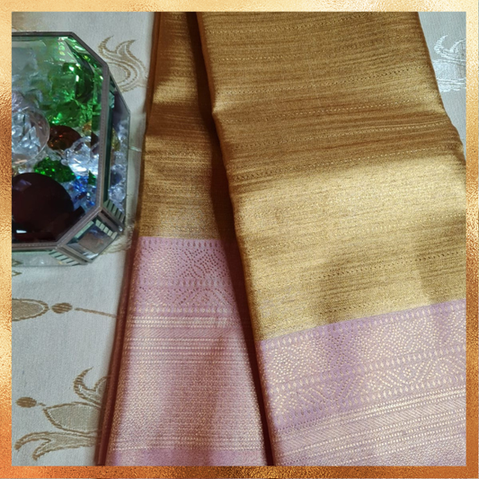 Bridal Kanjivaram golden body with light pink border & golden zari. Perfect for weddings & festive wear. Handpicked collection at The Saree Mahal