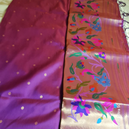 Dual Tone Magenta Paithani saree with traditional peacock & lotus motifs in gold zari border with tassels