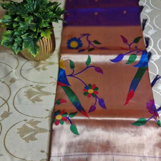Dual Tone Mauve Paithani saree with traditional peacock & lotus motifs in gold zari border with tassels