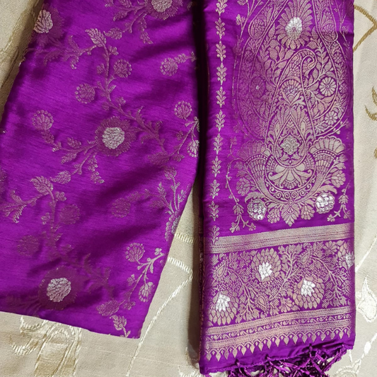 Magenta Benarasi saree with intricate gold zari detailing with tassels