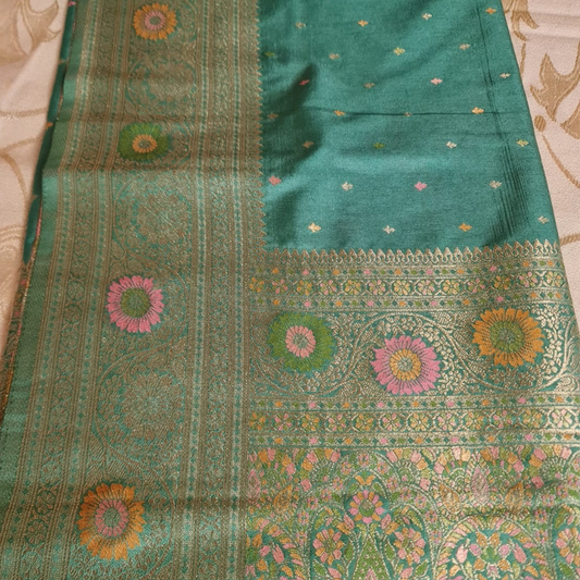 Teal Benarasi saree with intricate gold zari detailing with tassels 