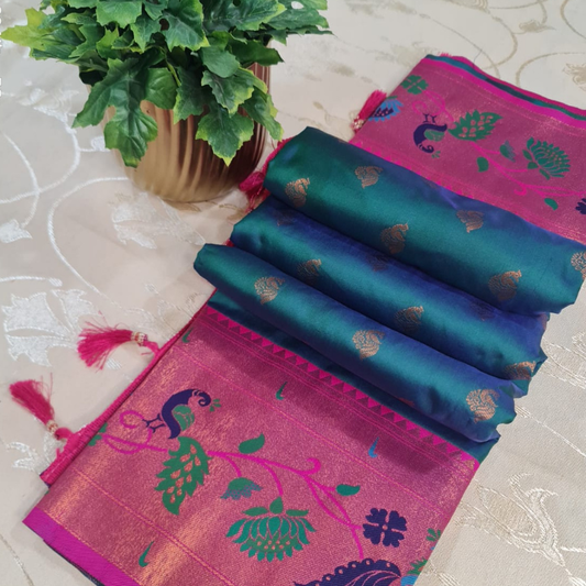 Handwoven Paithani saree with traditional colorful peacock and lotus motifs in gold brocade border
