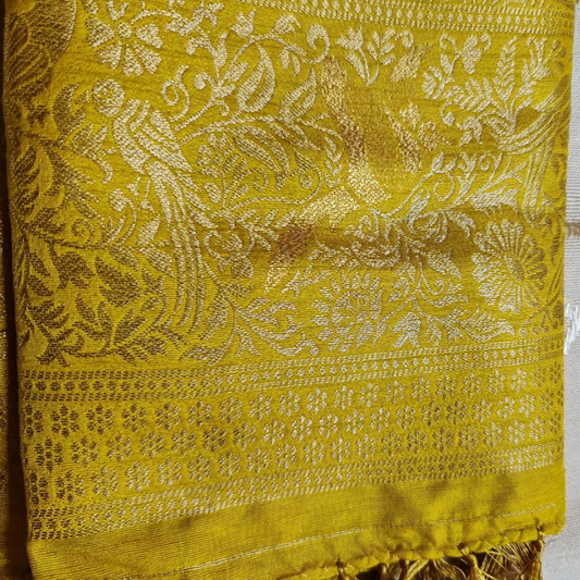 Yellow Benarasi saree with intricate gold zari detailing with tassels 